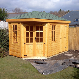 7' x 7' Corner Summerhouse with a 7' x 4' Separate Storage shed to the side. Mortice lock and key  with opening 6 pane windows.