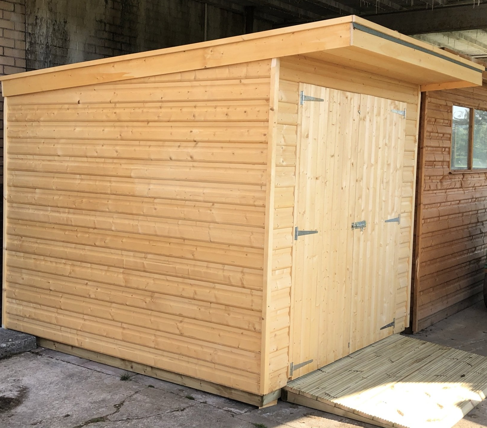 A 7' x 8' Storage shed with double doors delivered and installed to Ynystawe Cricket Club
