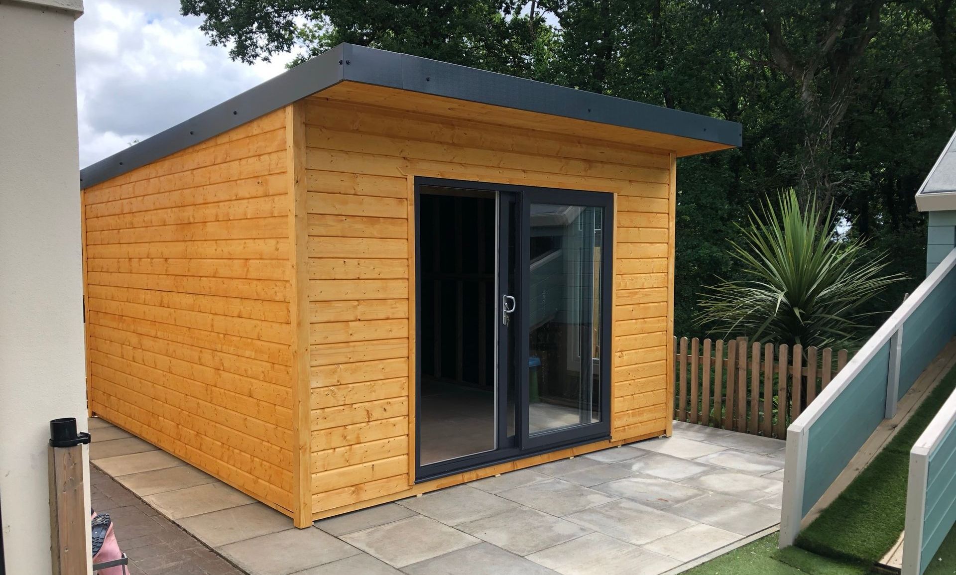 PVC Pent Contemporary Summerhouse painted in Golden Brown.