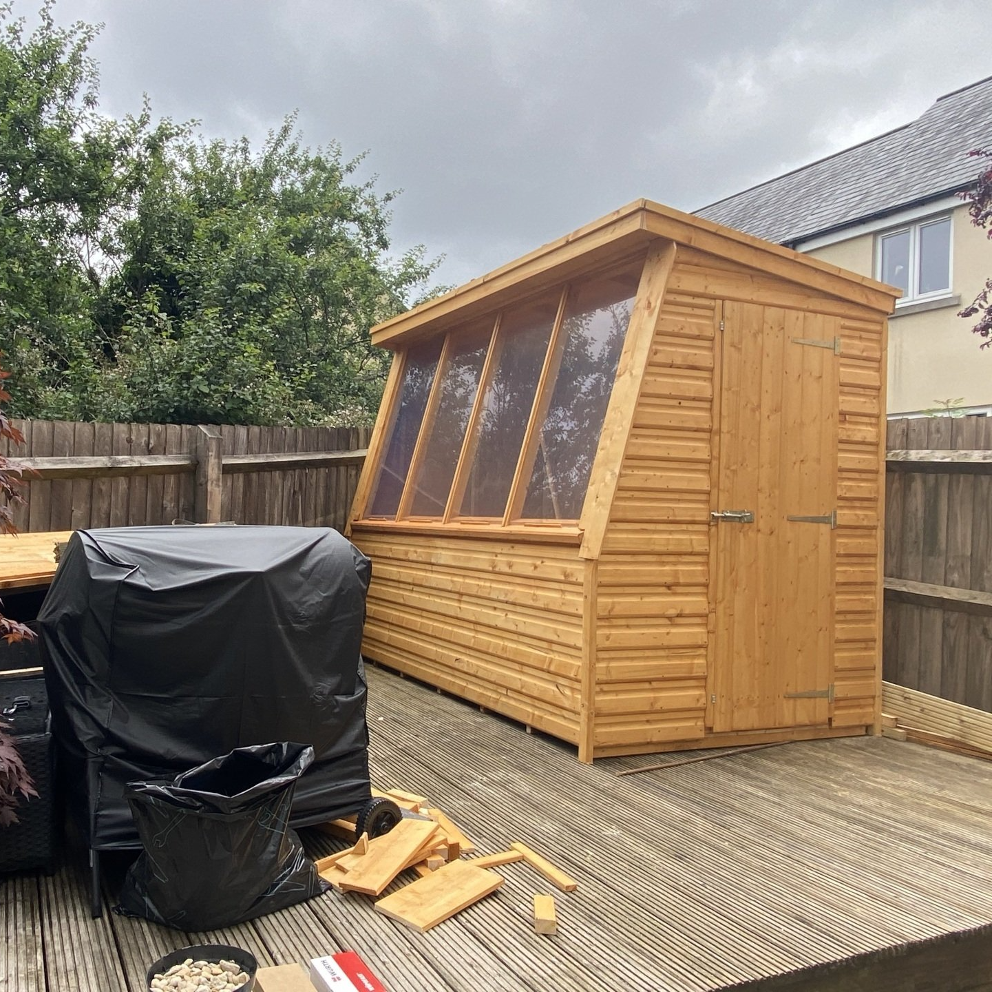 7' x 5' Potting shed installed on top of decking.