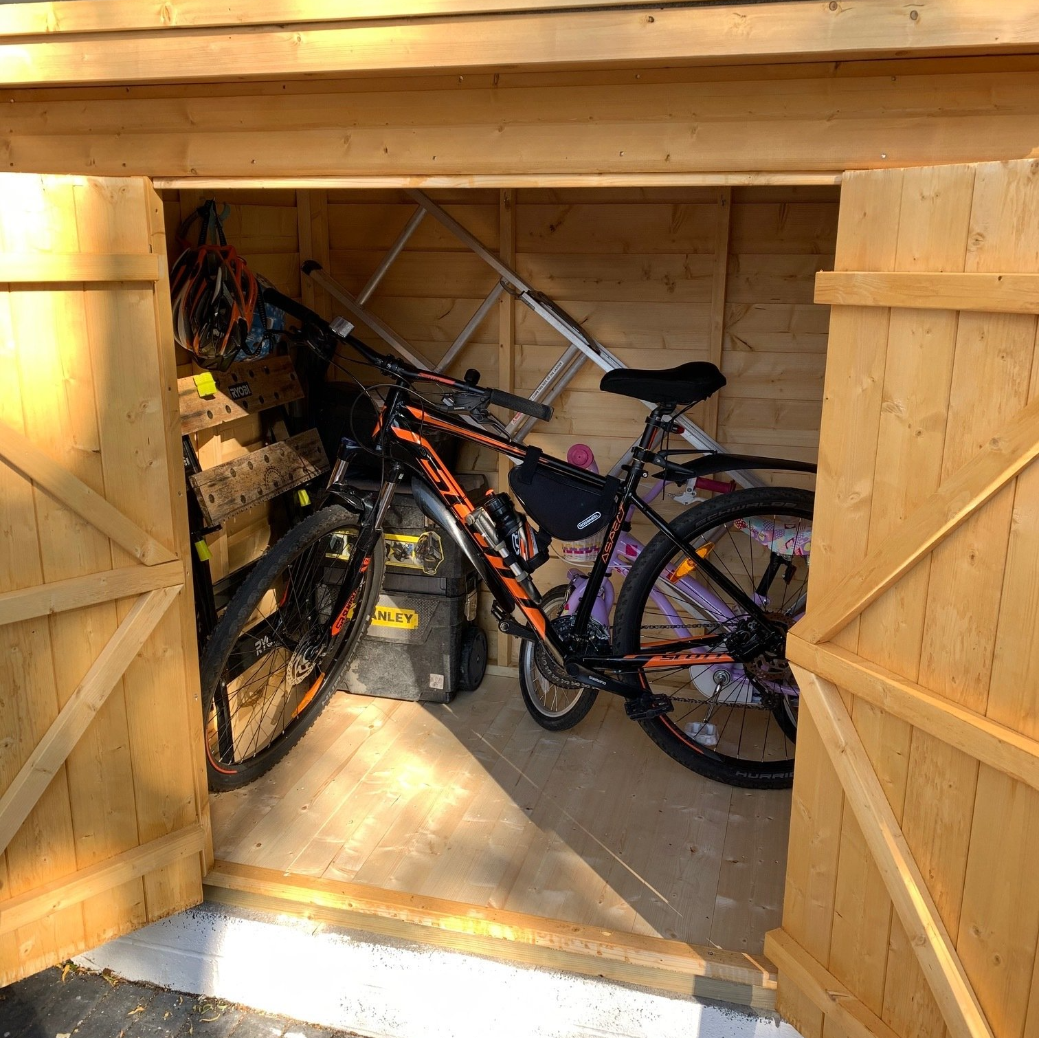 Bike store deep enough to hold a few bikes for a family and some tools. Brenton pad bolt installed so you can lock up securely.