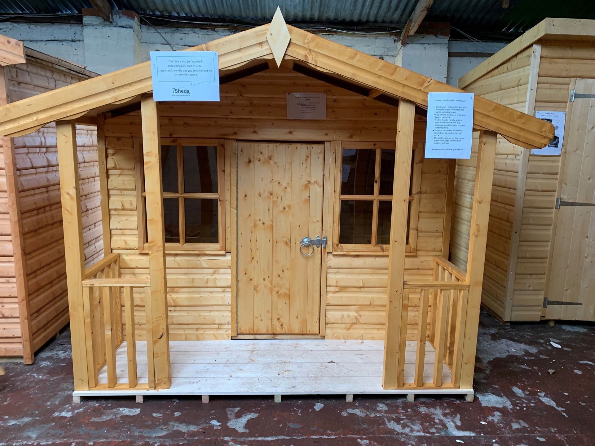 Playhouse for children with veranda and safety features