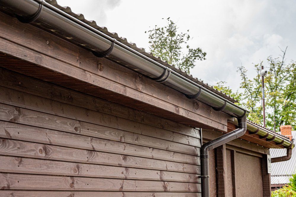 Guttering on wooden cabin roof — Plumber in Dubbo NSW