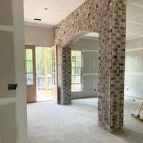 There is a brick wall in the middle of the room.