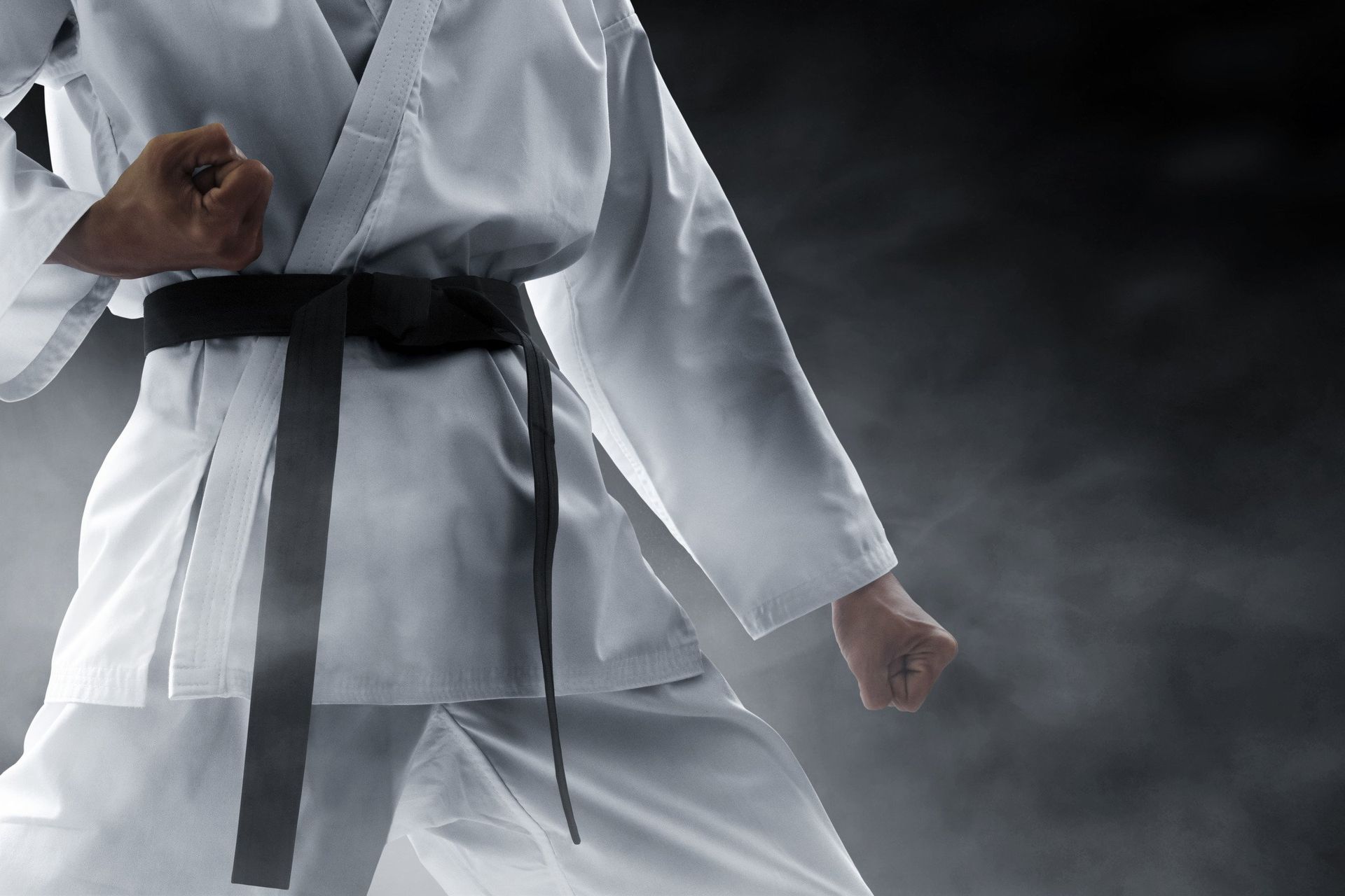 the black belt on the white uniform.