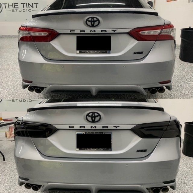 A silver car with the word camry on the back