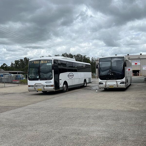 Parked Sodhi School Buses — Local Bus Hire in Lismore, NSW