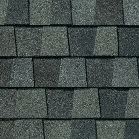 Dark gray asphalt roof shingles, overlapping pattern.