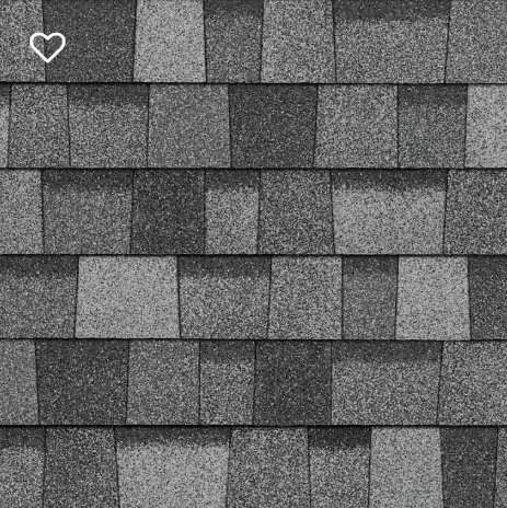 Close-up view of a shingle roof with varying shades of gray.