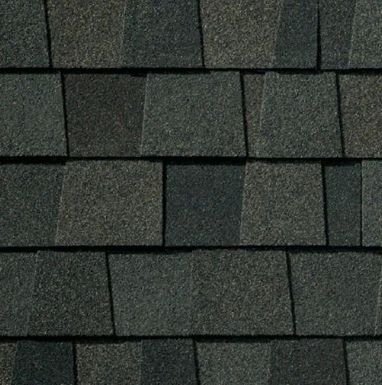 Dark gray asphalt roof shingles, textured surface.