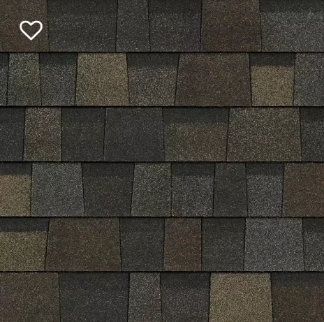 Close-up of asphalt roof shingles in varying shades of gray, brown, and tan.