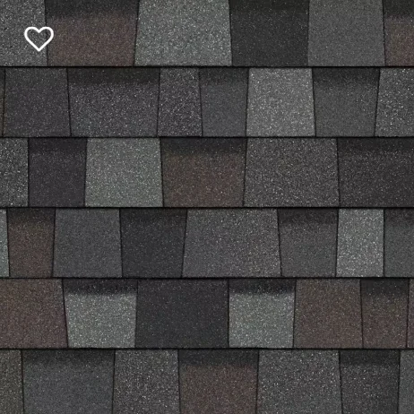 Close-up of asphalt shingles in shades of gray, black, and brown.