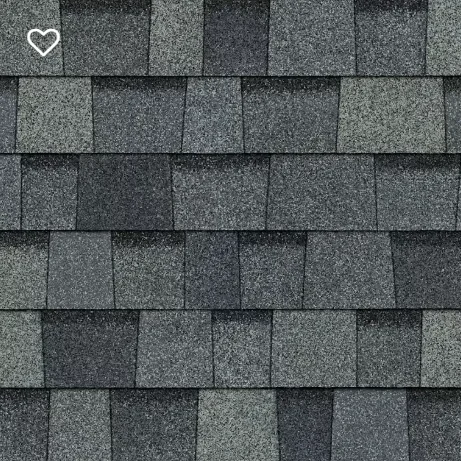 Dark gray asphalt roof shingles with varying shades, arranged in a pattern.
