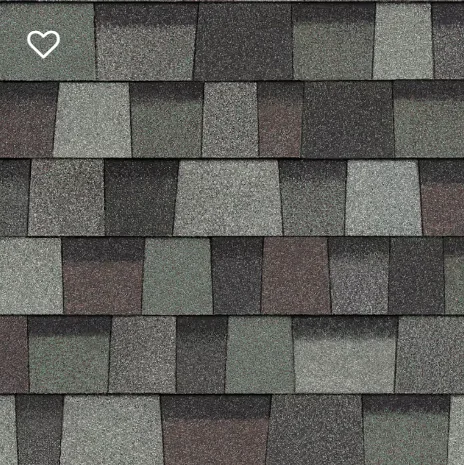 Close-up of asphalt roof shingles in a mix of gray, black, and brown tones.