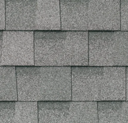 Gray asphalt roof shingles in a staggered pattern.