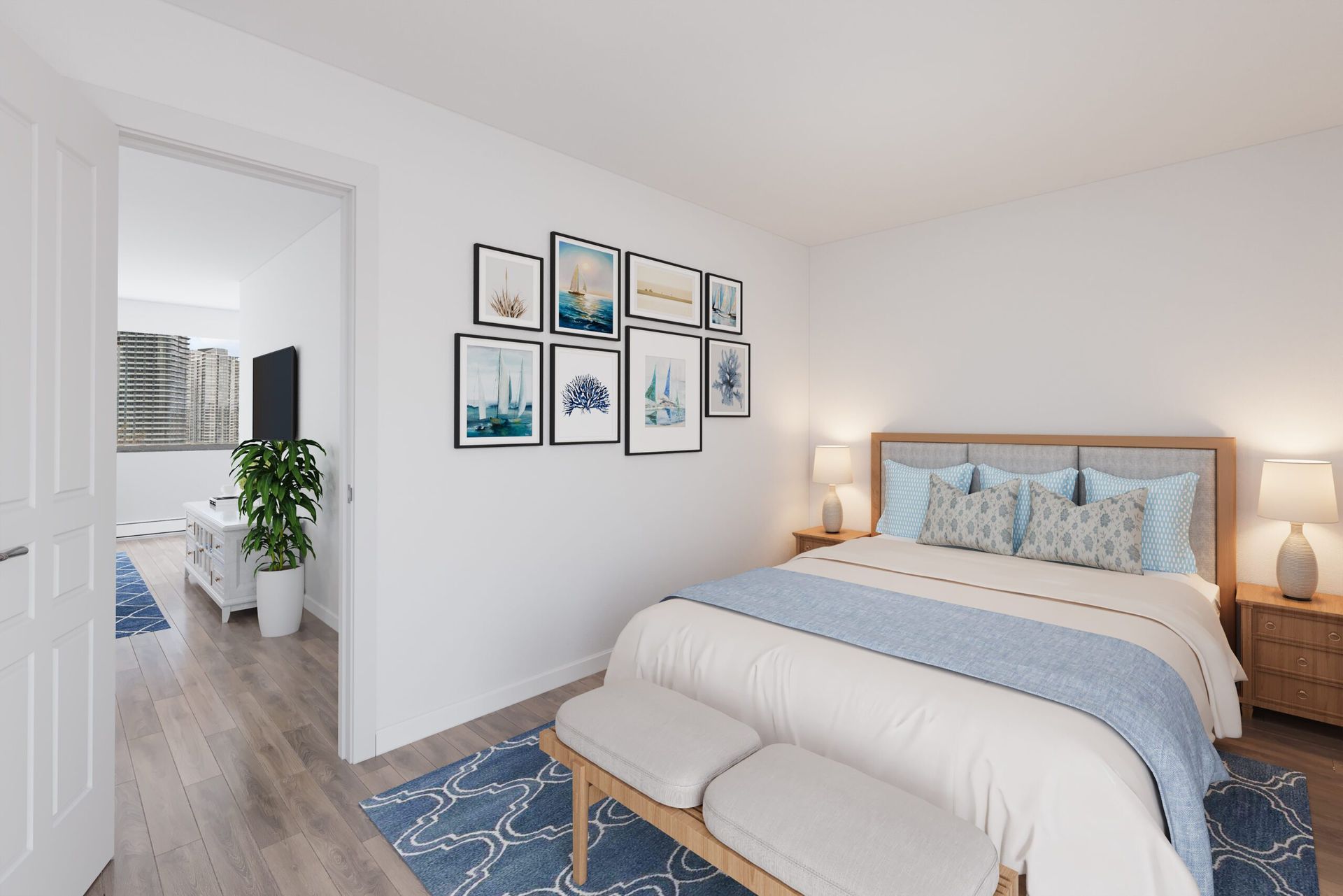 Bedroom with bed, artwork, rug, and doorway to living area. White walls, light wood floors, and a bench at the foot of the bed.
