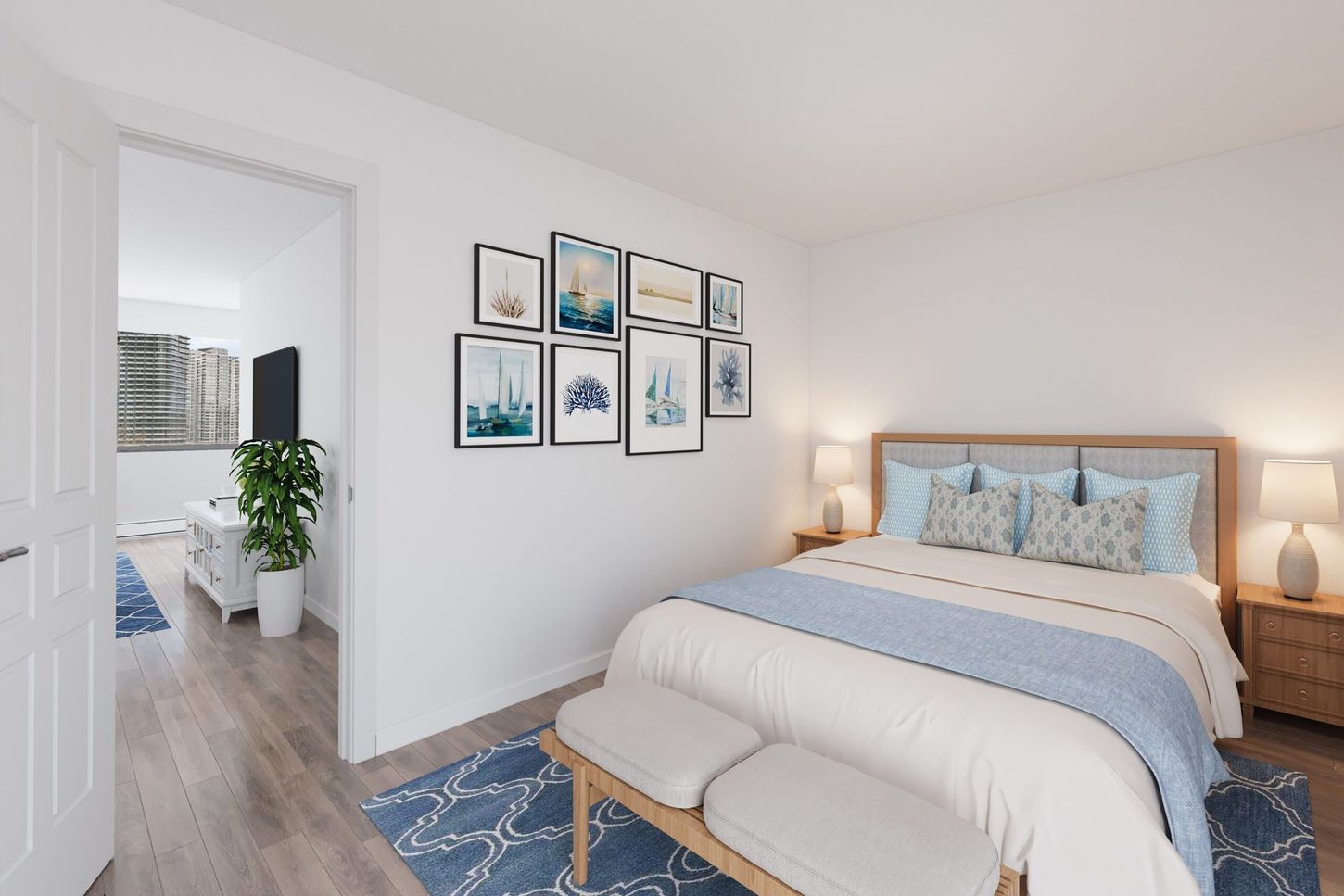 Bedroom with a bed, art, two lamps, and a view to another room. White walls with blue accents.