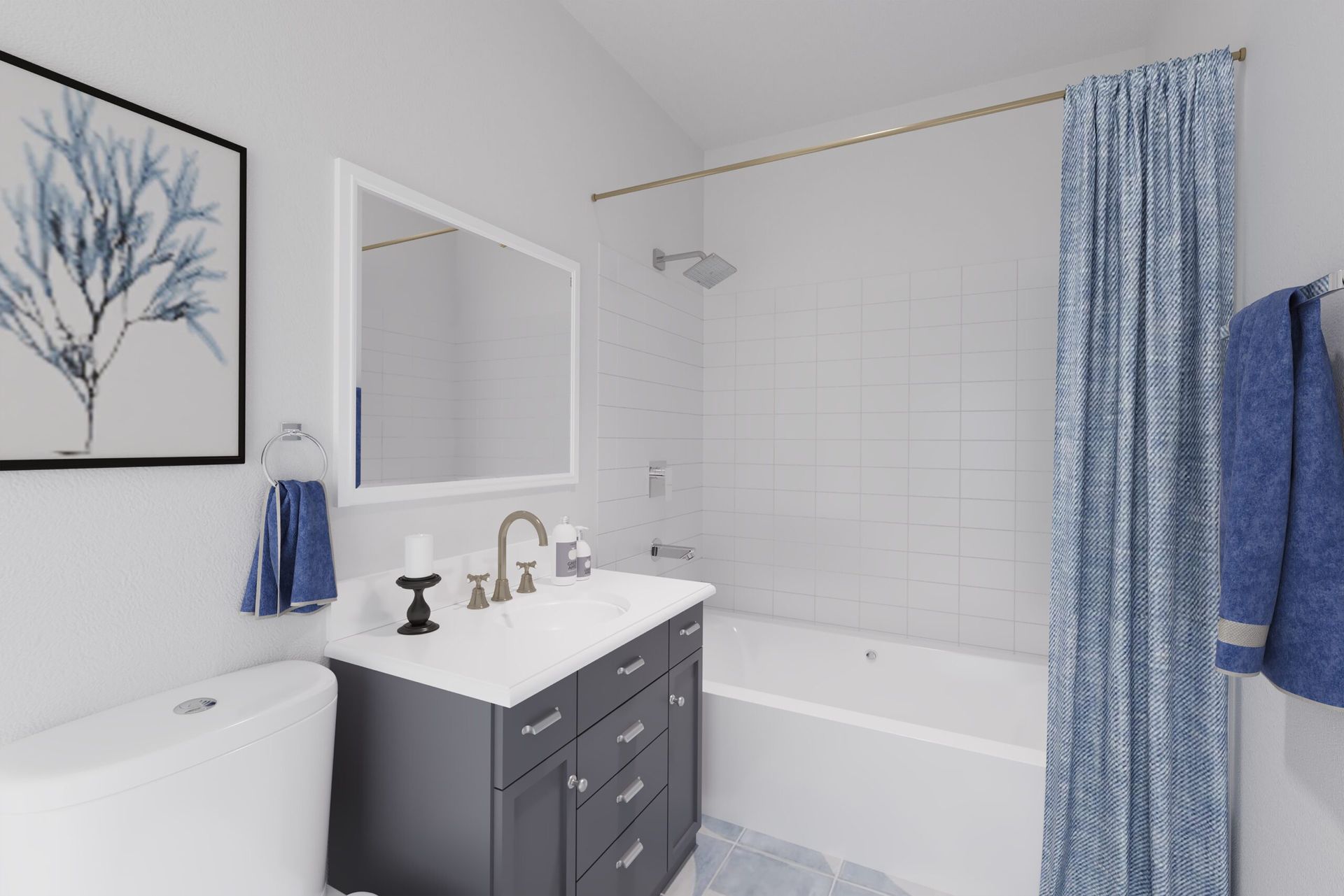 Bathroom with white walls, gray vanity, blue accents, and shower curtain.