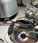 A close up of a machine with a lot of wires coming out of it.