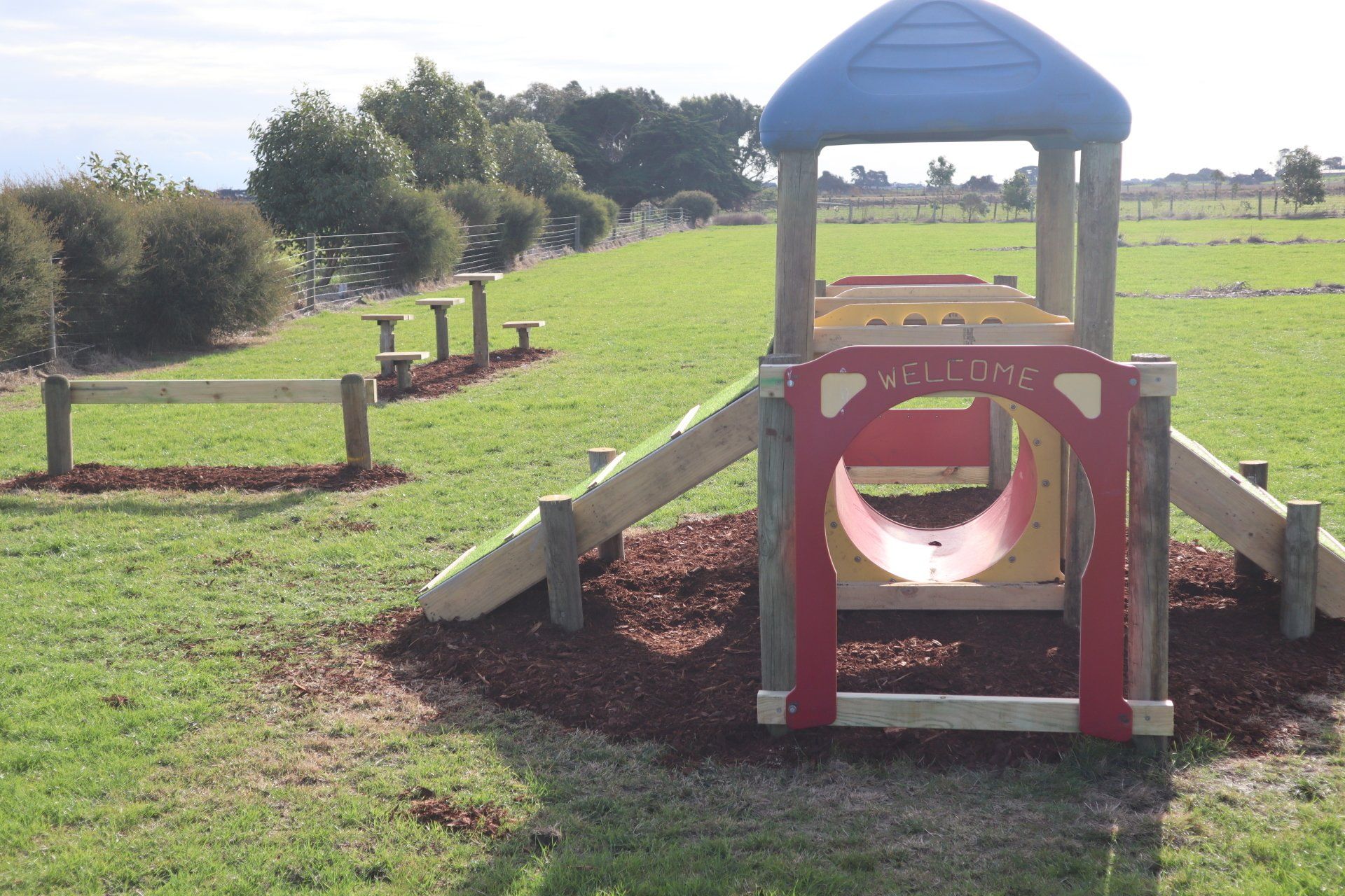 Kids play tunnel in the adventure playground at Gum Tree Caravan Park on a sunny day