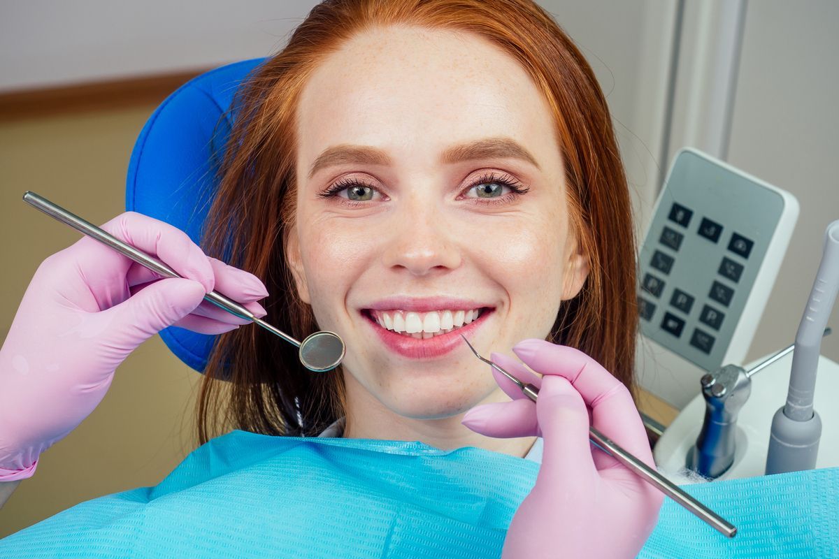 Dentist | Woman Smiling | Root Canals Prosper TX