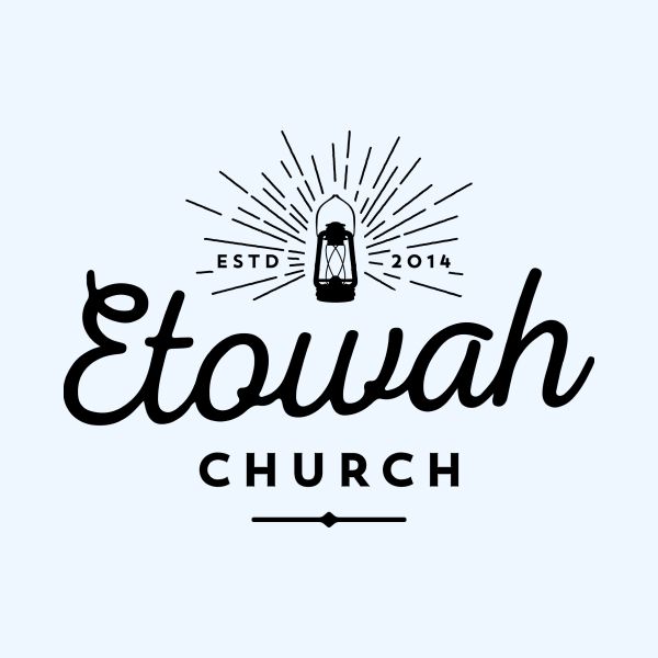 A black and white logo for a church called etowah church