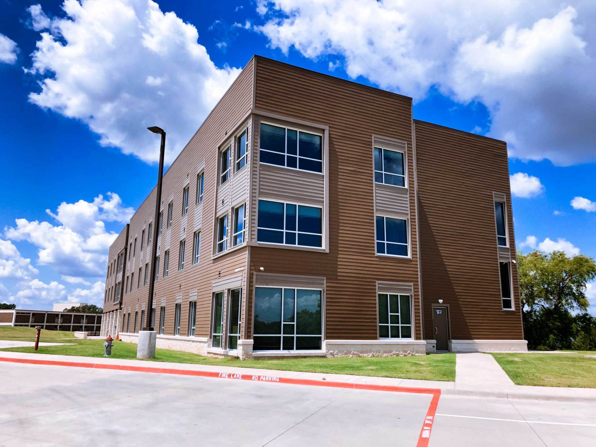 College dormitory fiber cement siding job by Preview Construction.