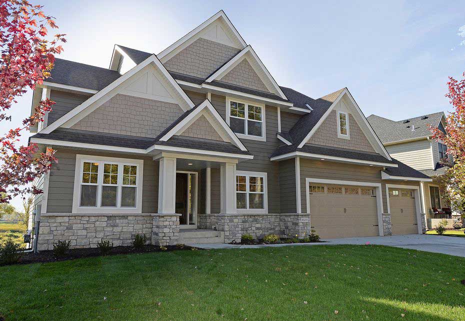 A large house with a large lawn in front of it