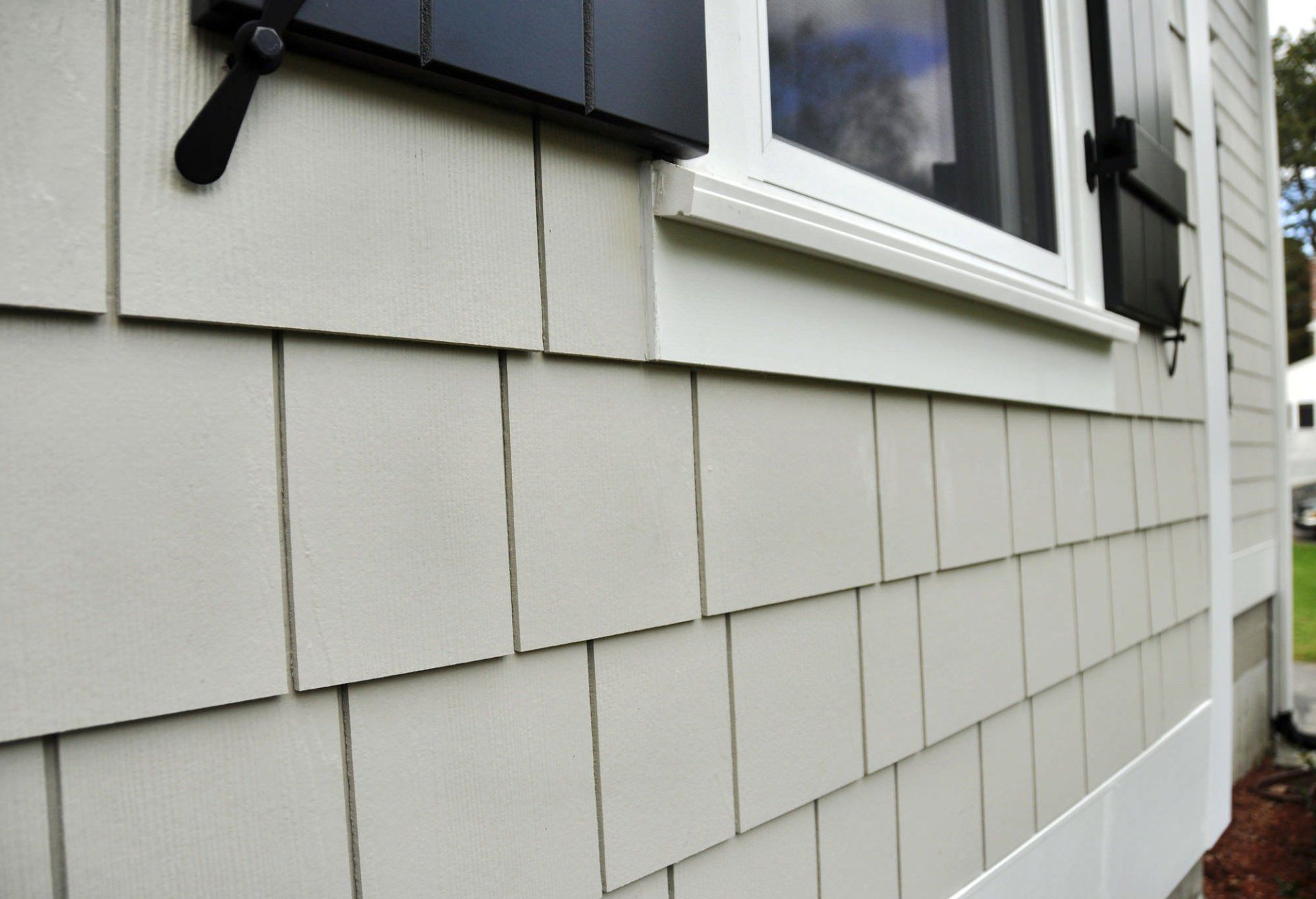 Beige Fiber Cement Siding in Shingle design in Odessa, Texas.