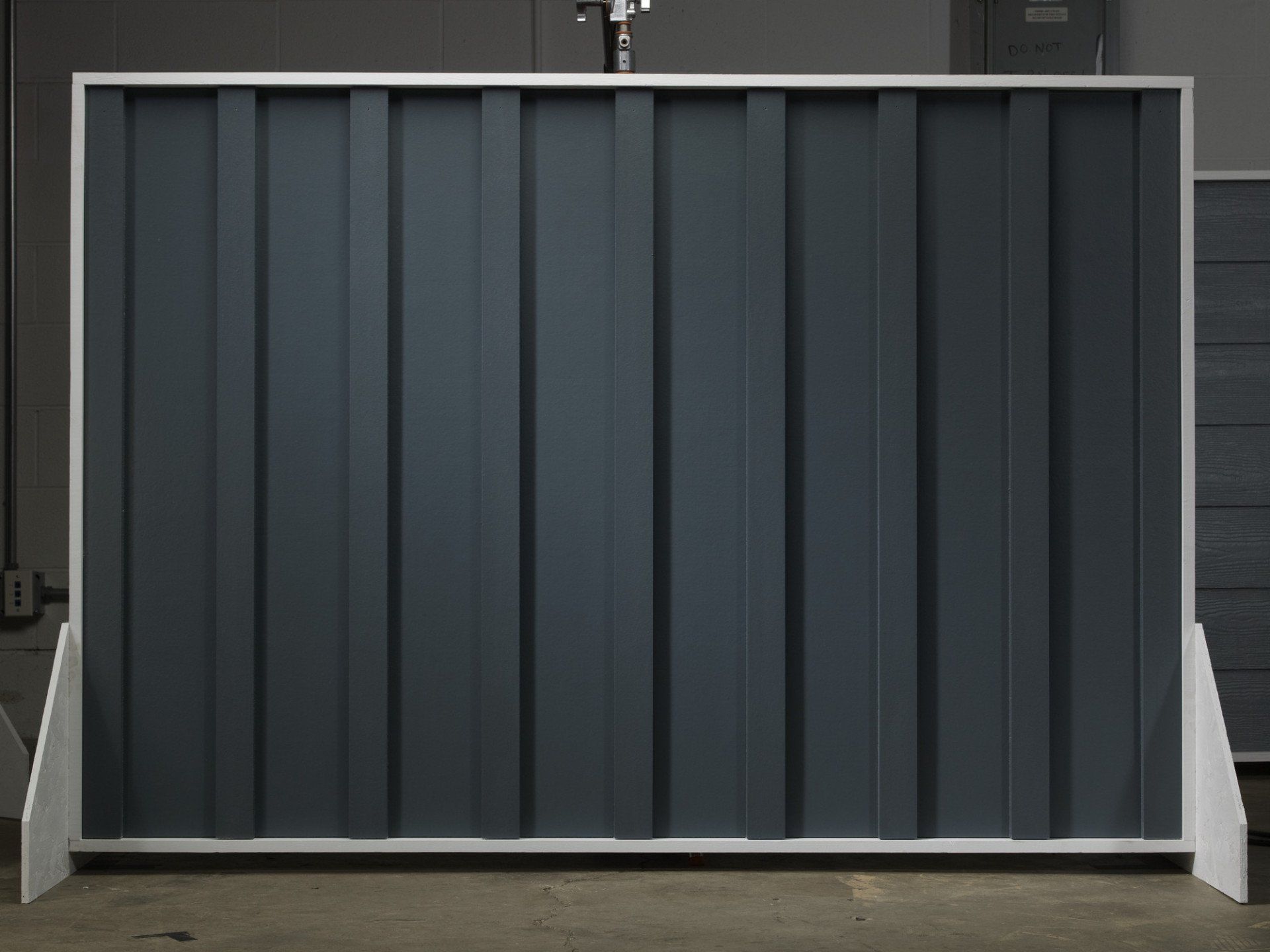 Evening Blue smooth vertical siding with Batten Strips