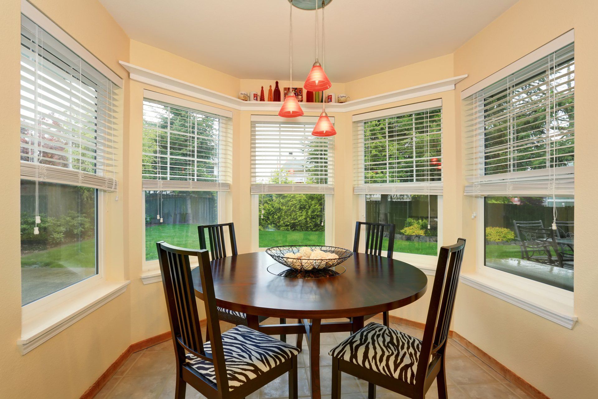 White Wood Windows around a dinning table space.