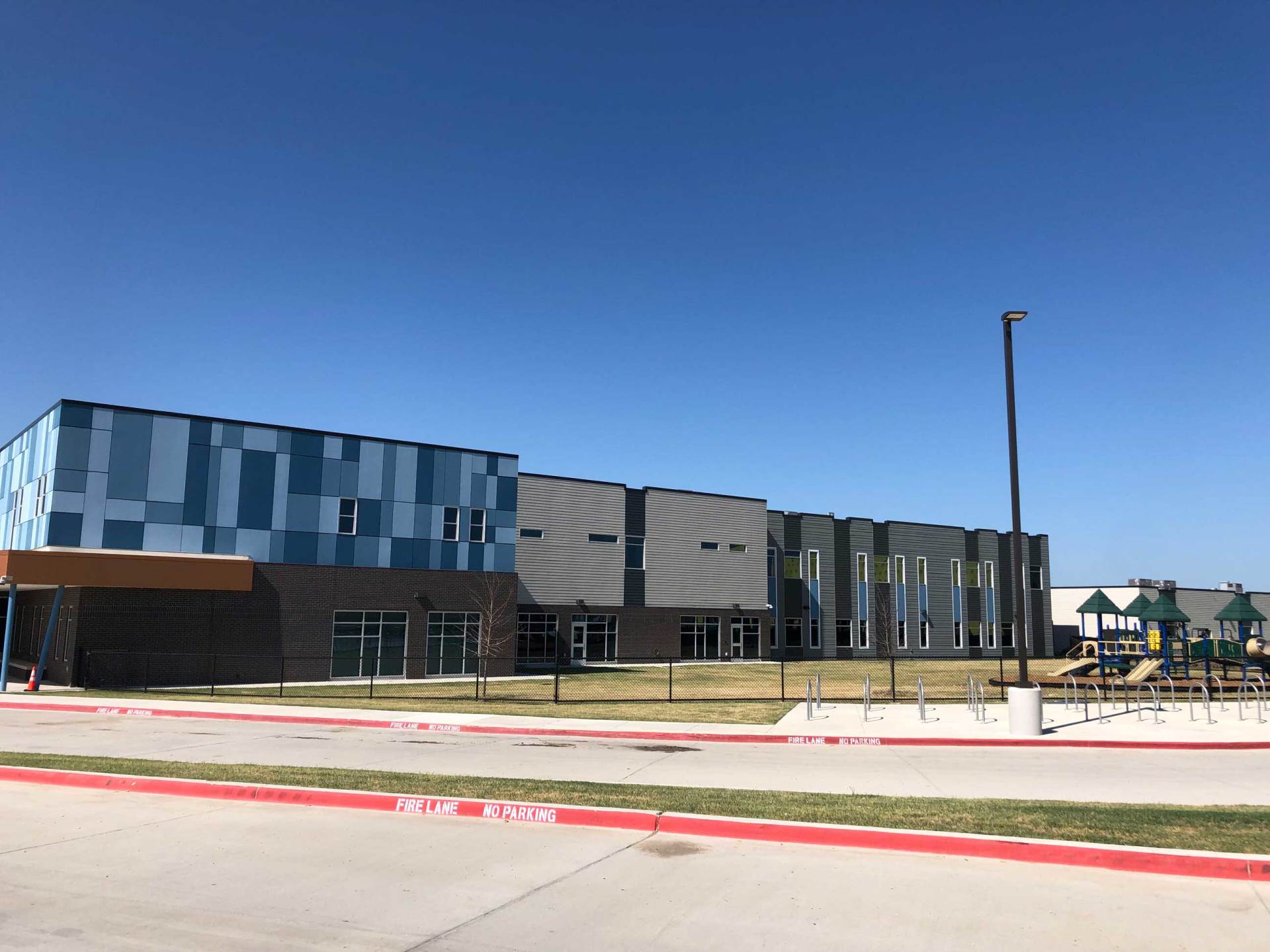 James Hardie Reveal System on a rain-screenand James Hardie lap siding. A school in Fort Worth, Texas.