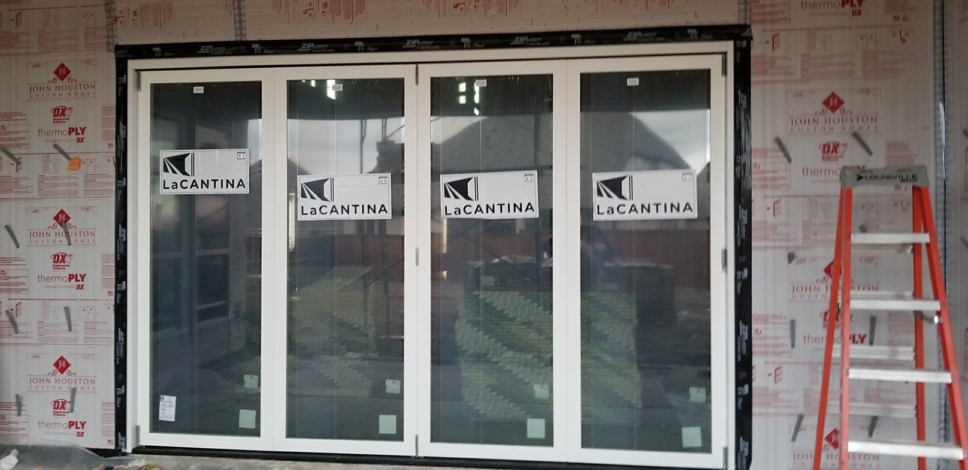 Lacantina Bi-fold door for new construction by Preview Construction.