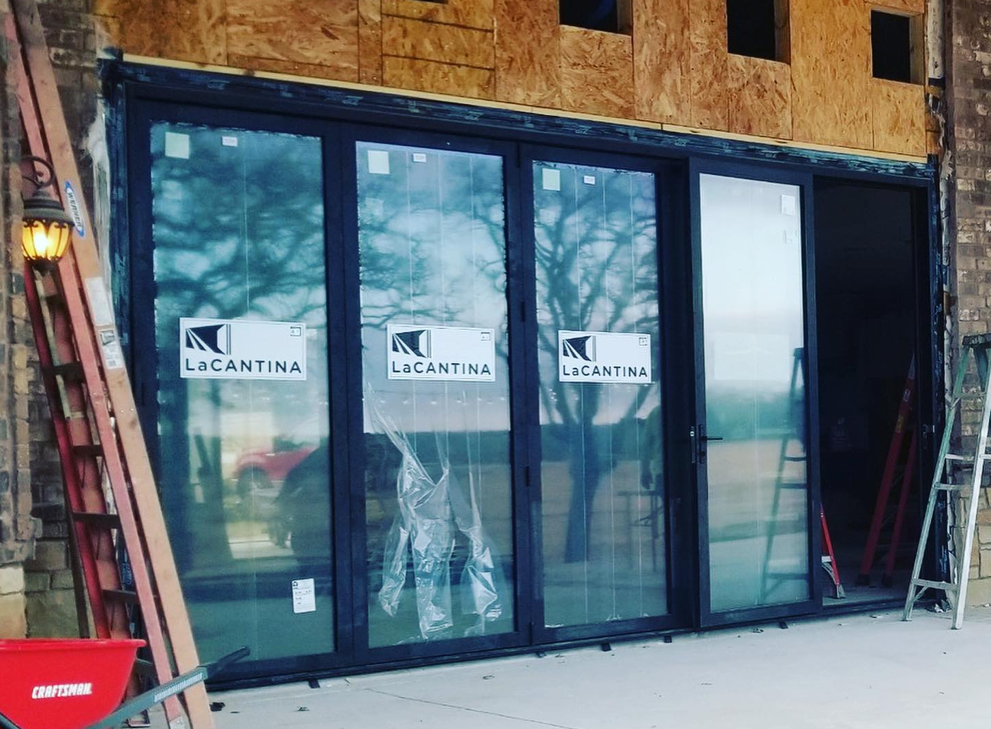 Lacantina Folding  Big Door installed in Texas by Preview Construction.