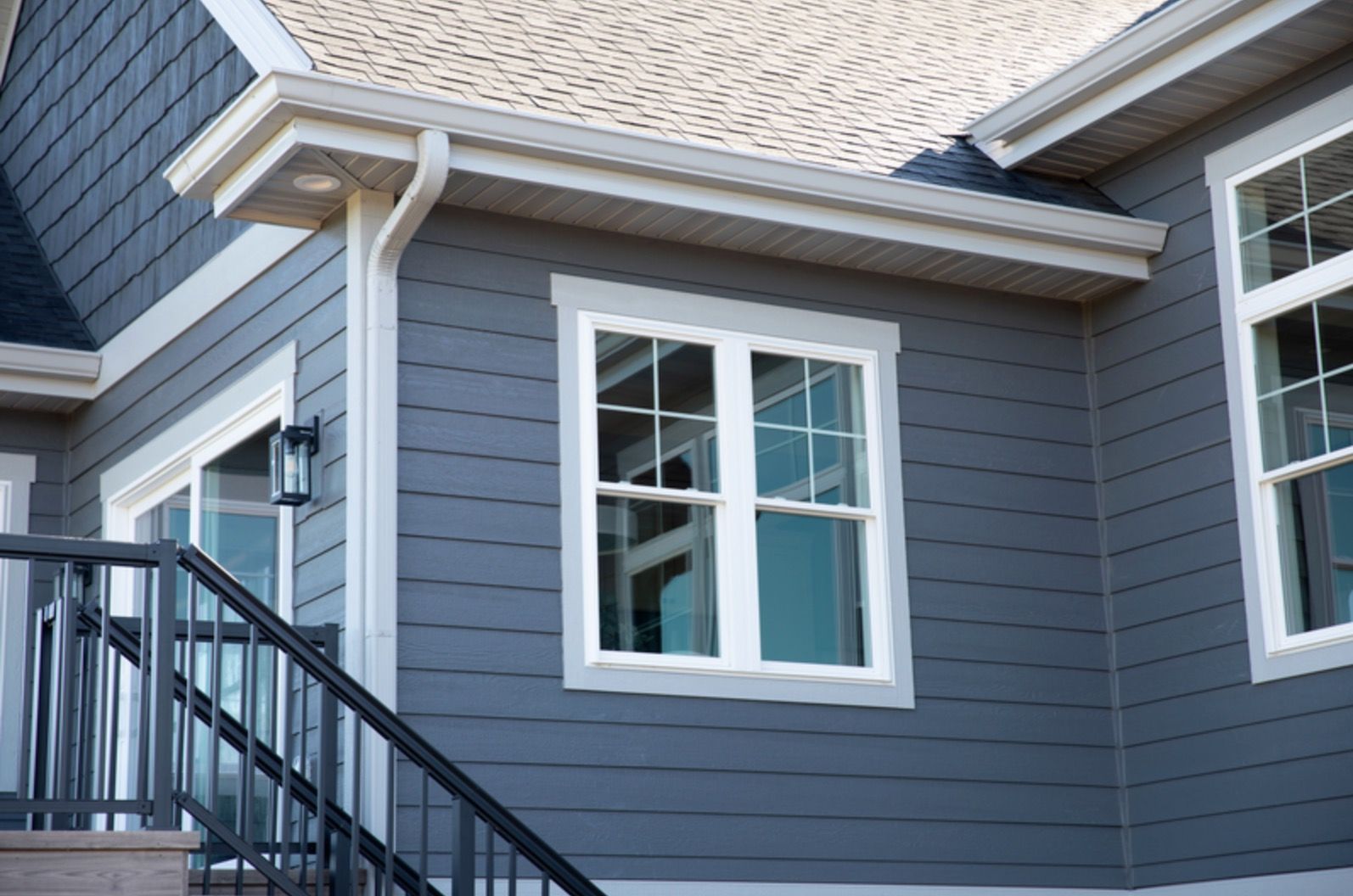 LP Siding in blue panel with white trim.