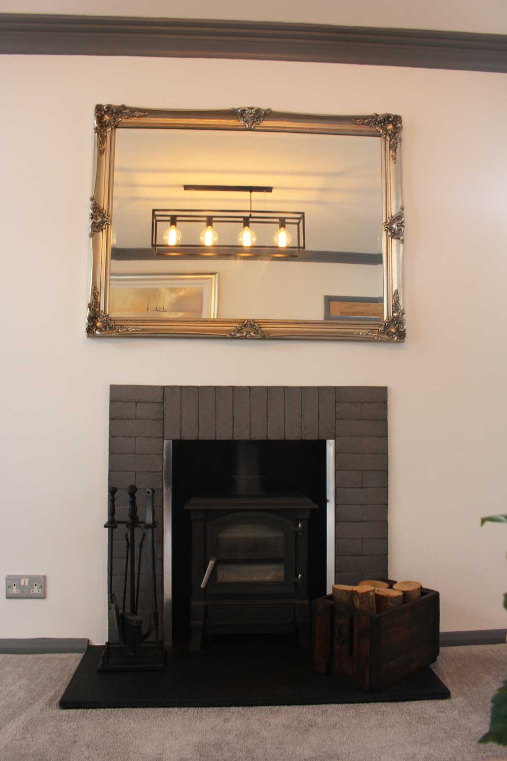 fireplace with a miror