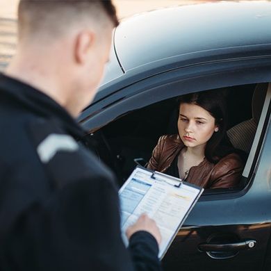 Policeman Writes Fine to a Female Driver — Tuscaloosa, AL — Wayne L Williams & Associates LLC