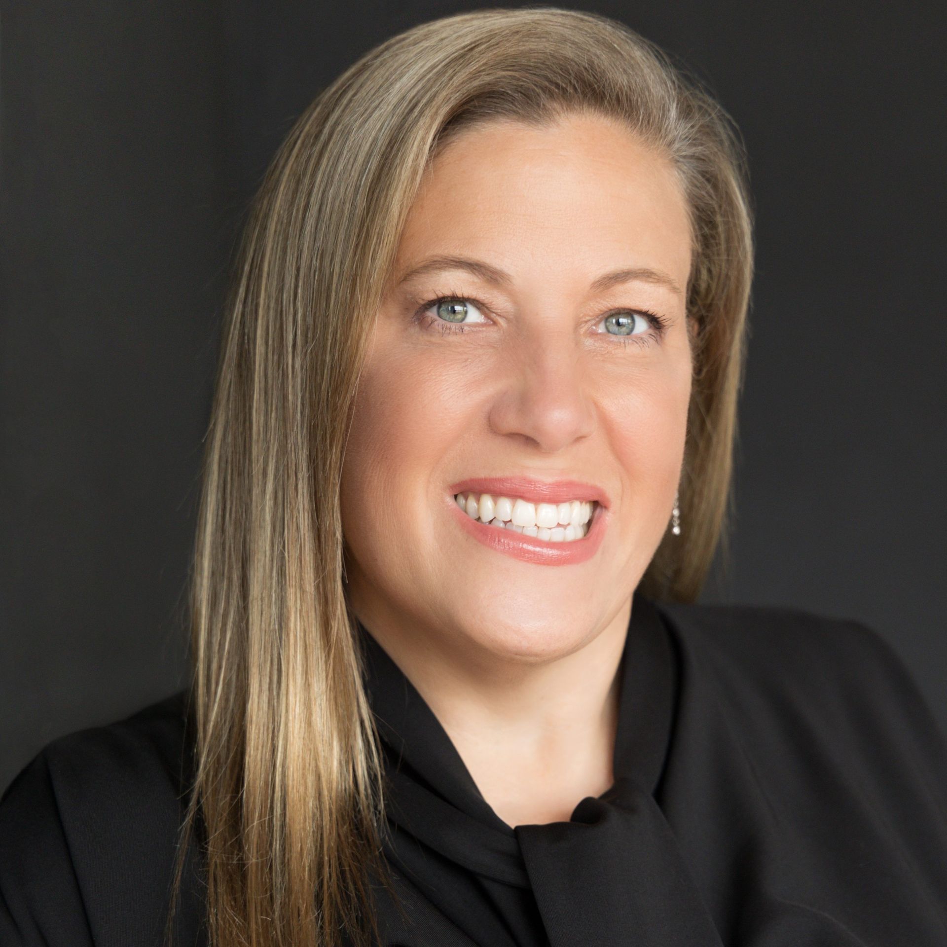 DEB CURRY Profile Picture - a woman in a black shirt and tie is smiling for the camera .