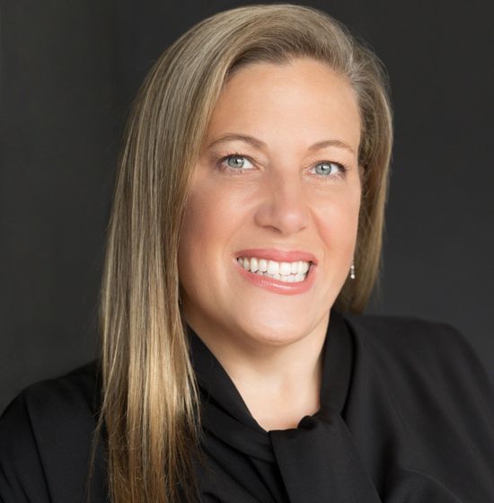 DEB CURRY Profile Picture - a woman in a black shirt and tie is smiling for the camera .