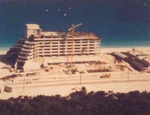 An aerial view of a building under construction on the beach