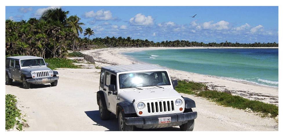 Jeeps at the beach in Riviera Maya.