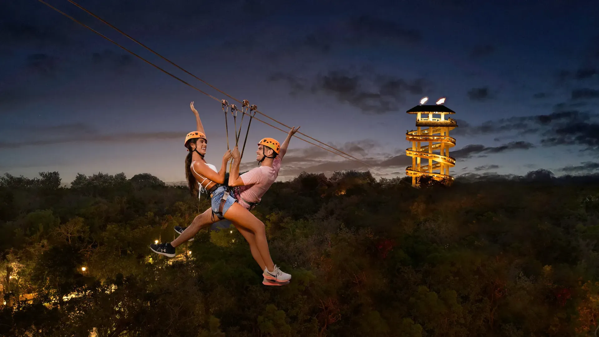 A couple zip-lining at Xplor