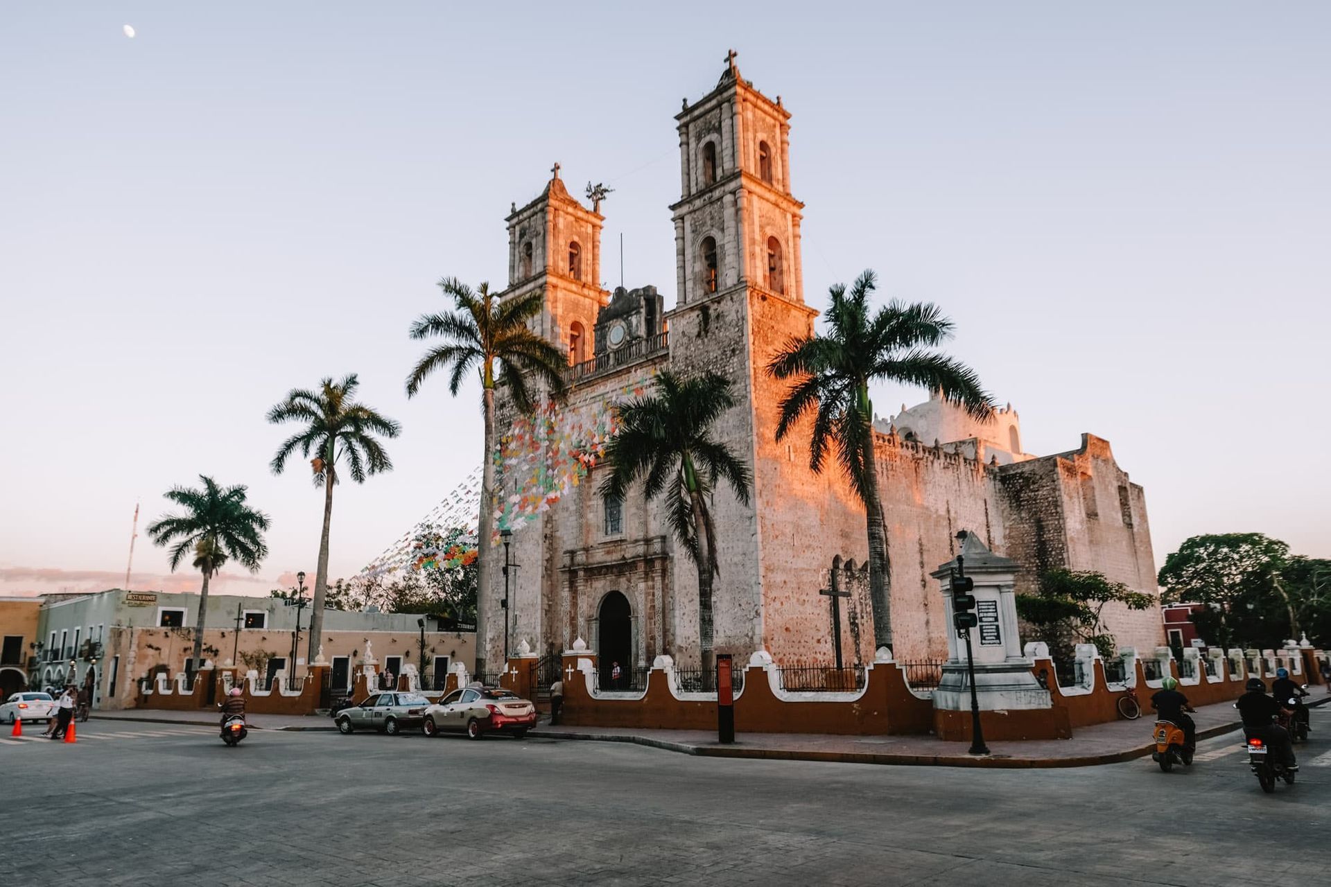 A large church with palm trees in front of it