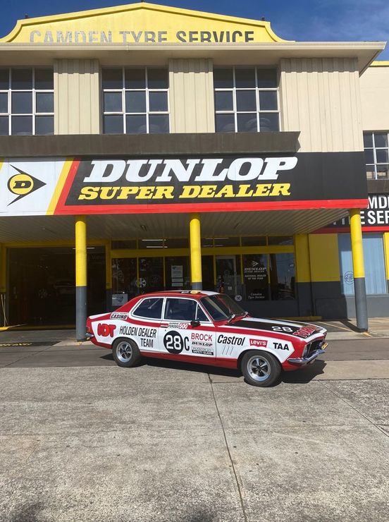 Car in Front of Dunlop Super Dealer Shop — Camden, NSW — Camden Tyre Service