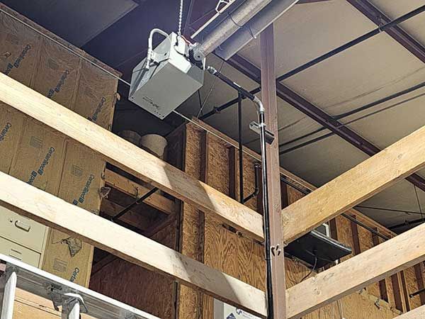 A ceiling fan is hanging from the ceiling of a building.