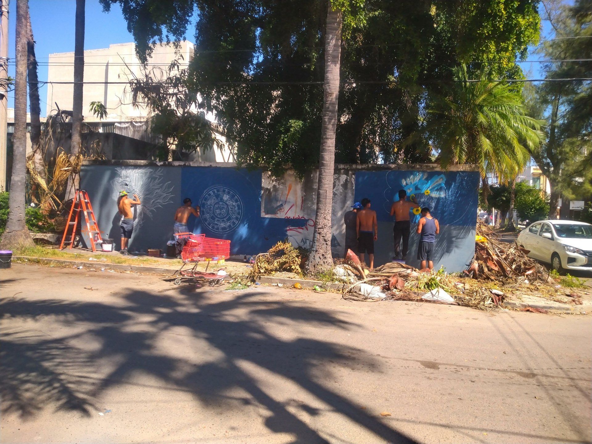 Young street artists at work on a wall in Mazatlan, Sinaloa, Mexico