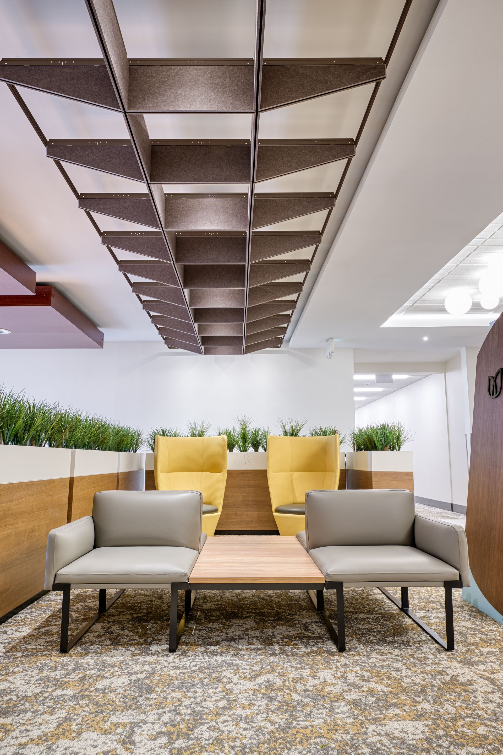 There are two chairs and a table in the room.