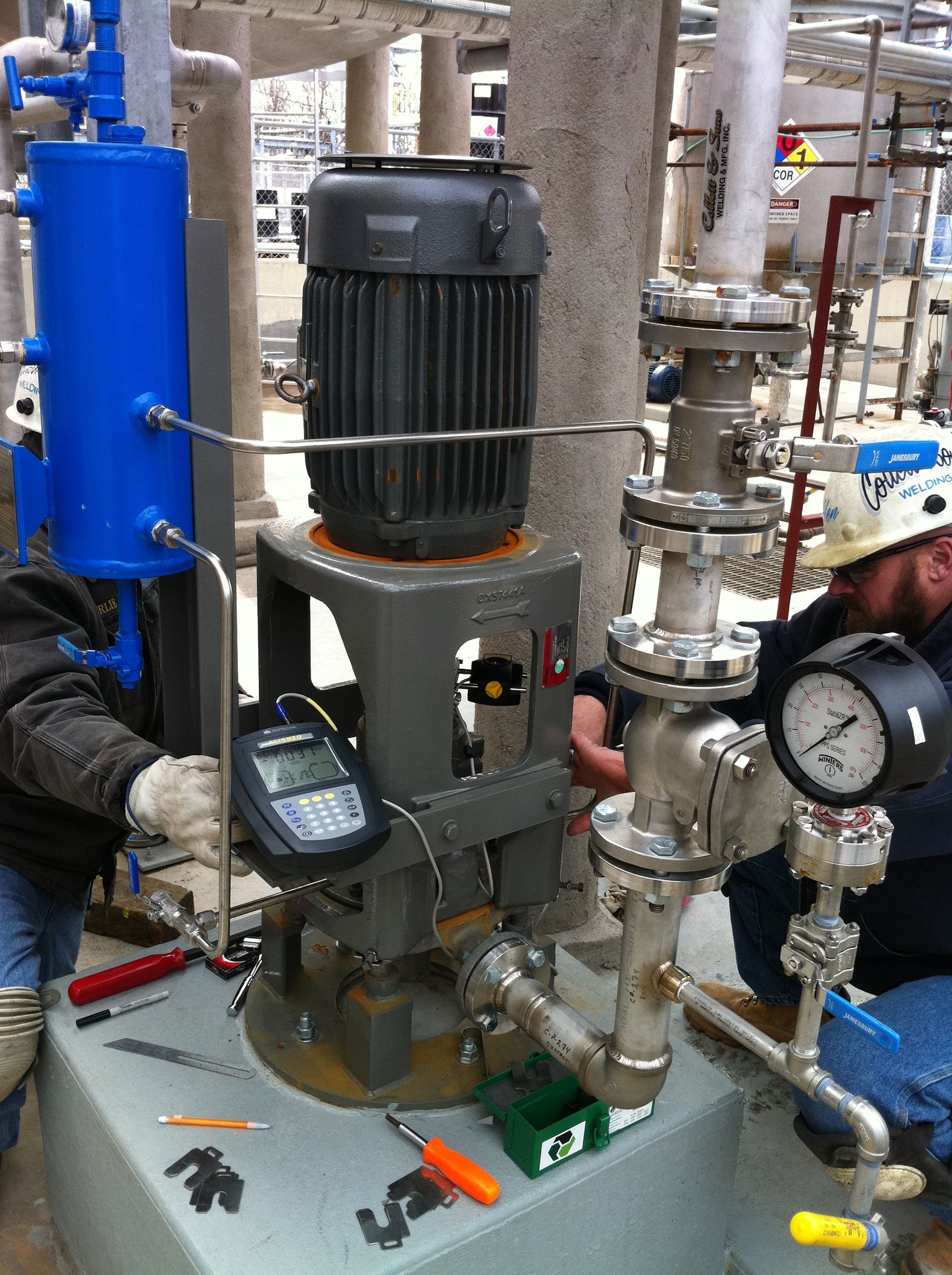 A man is working on a machine that has the number 1 on it