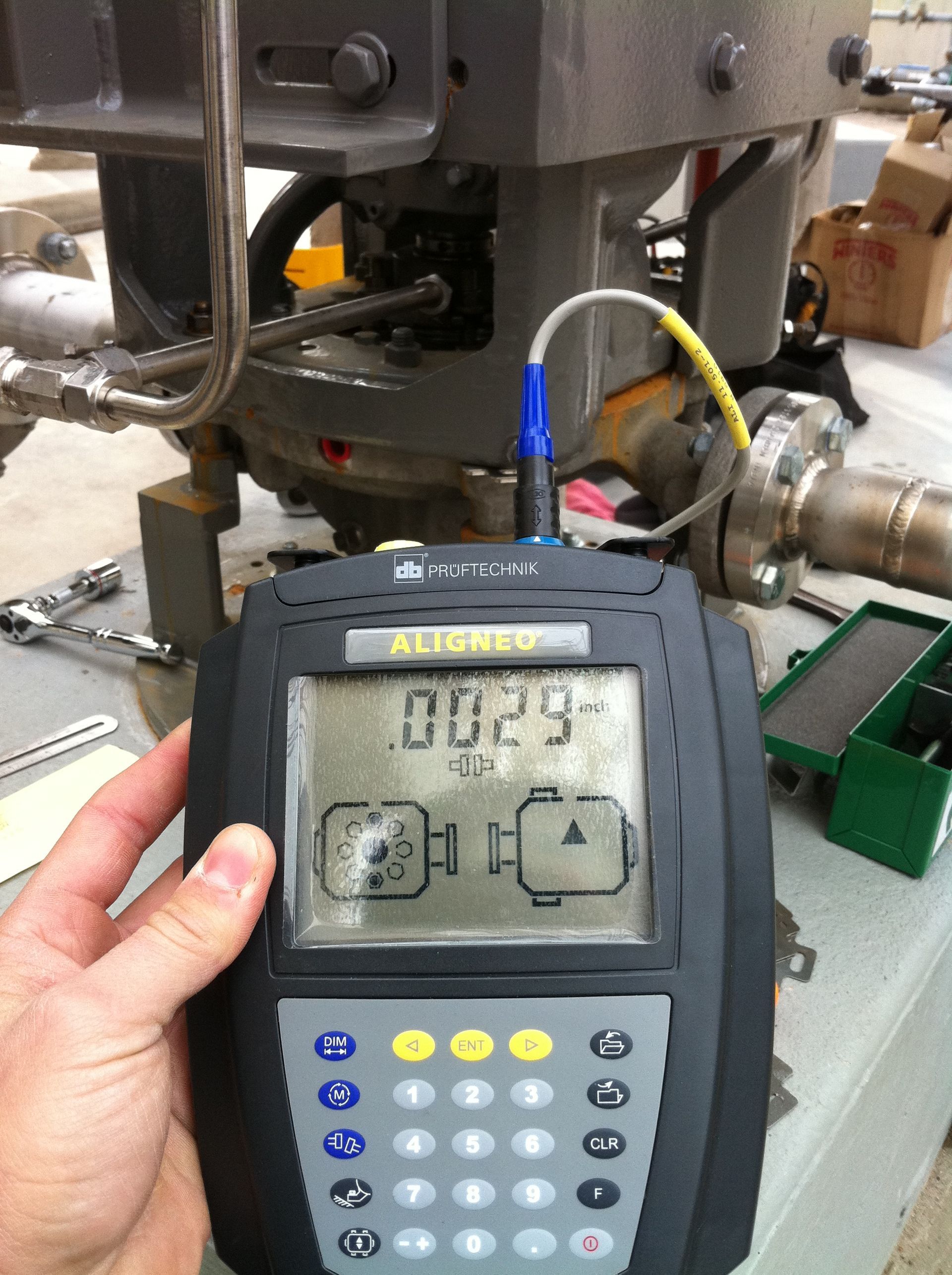 A hand is holding a device that shows 00:29 on the screen