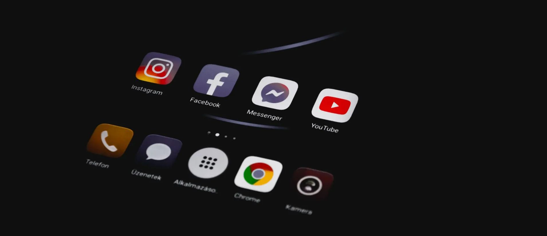 Social Media A close up of a cell phone screen with social media icons on it.